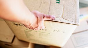 picking up a box from the floor